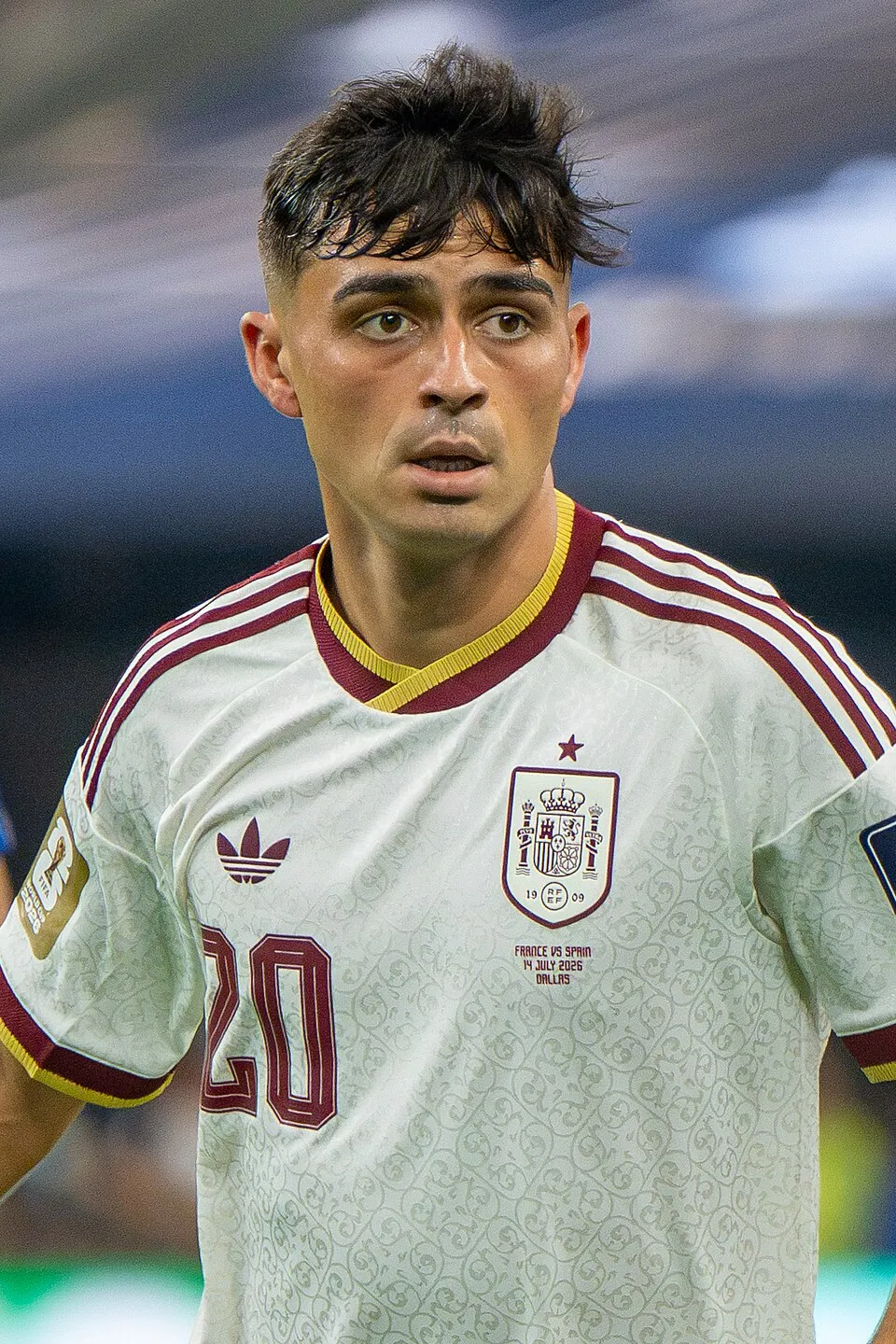 Young footballer in a custom sublimation jersey, inspired by Spain's Pedri, demonstrating agility on the pitch.
